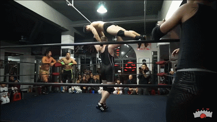 Middle-Kingdom-Wrestling-MKW-Big-Sam-drops-Jason-Wang-with-Military-Press-and-poses.gif